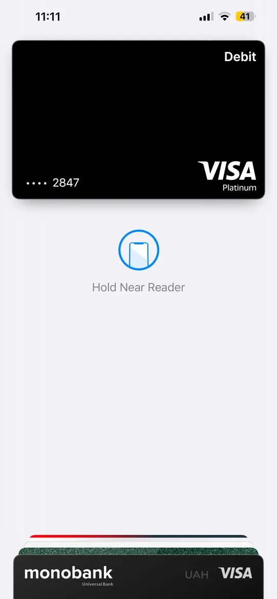 Paying with a card in Apple Wallet: Hold Near Reader screen on iPhone